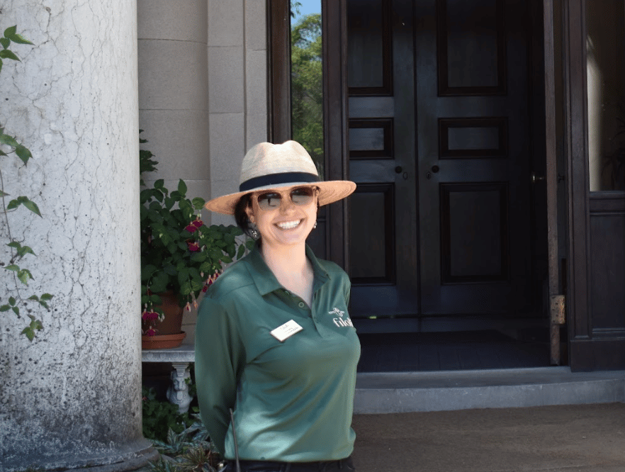 Filoli staff in dark green uniform shirt.