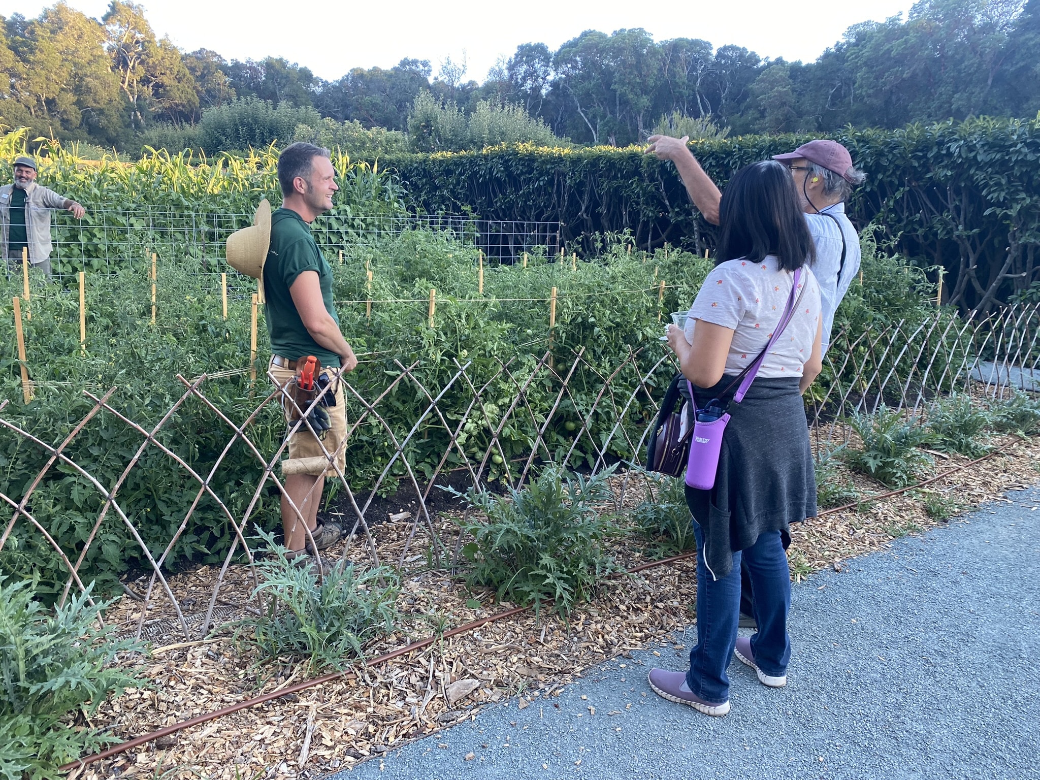 Filoli staff members James and Jim talk with visitors in the Vegetable Garden during Summer Nights, September 2022.