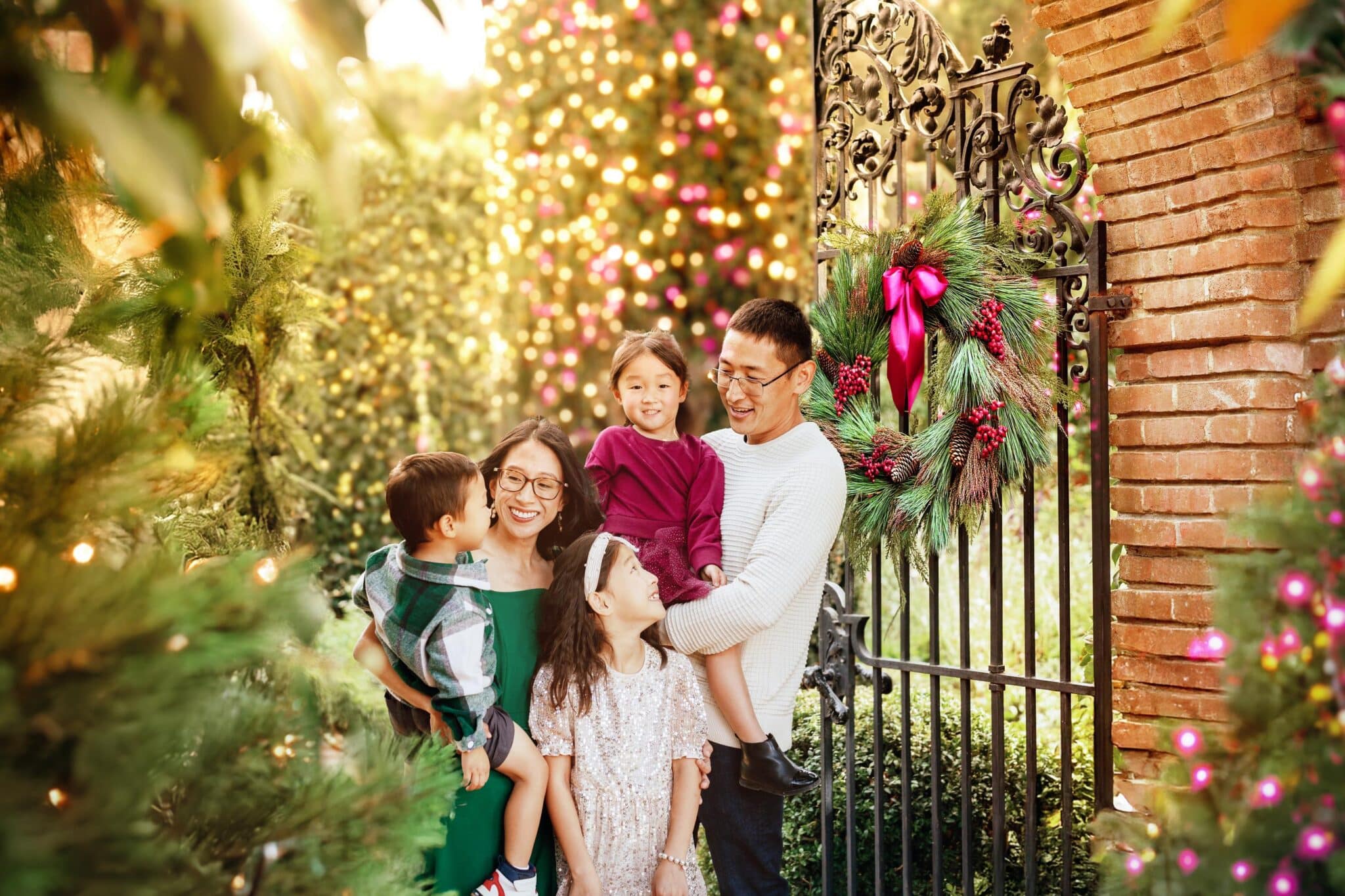 Family Enjoying The Holiday Garden Lights In The Daytime Family enjoying the Holiday Garden Lights in the Daytime